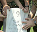 Setting a head stone.