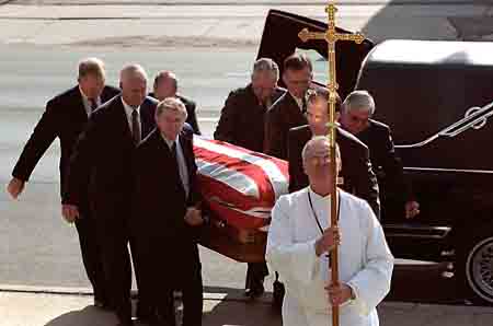 Milan Bish's flag-covered coffin - photo by Barrett Stinson.