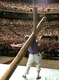 Joe White stands with Cross before a sea of Promise Keepers.