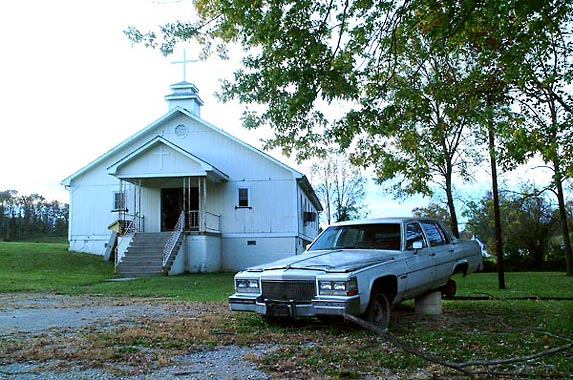 Cadillac sedan and Franklin County Church - photo by John Perkins.