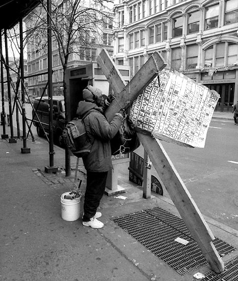 Man with Cross - photograph by Dave Beckerman.