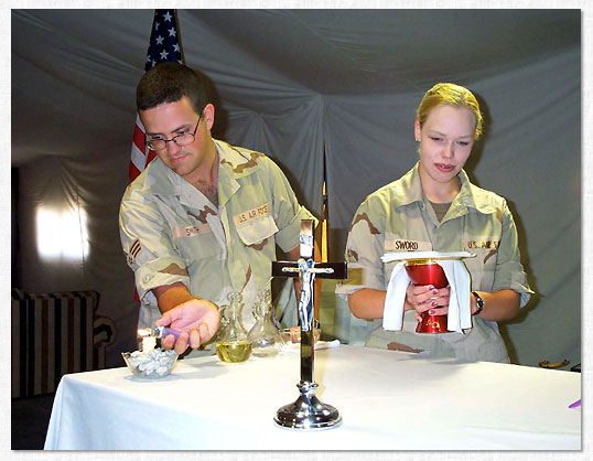 Andrew Smith and Sara Sword setup the altar.