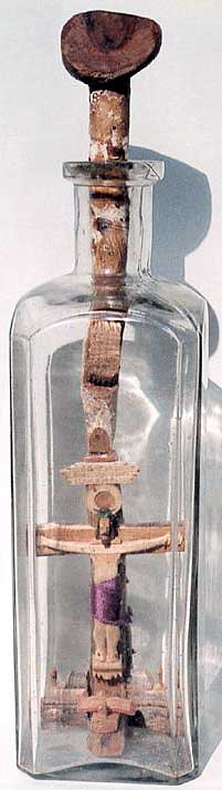 Crucifix in a bottle by The Caveman.