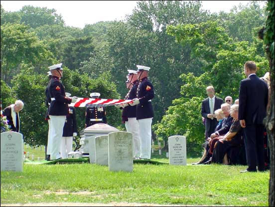 USMC Body Bearers get ready to fold the flag.